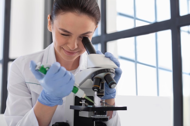 Scientist working with microscope