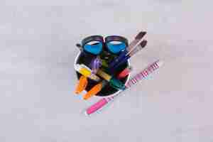 Free photo scissors, brushes and pencils in pen holder