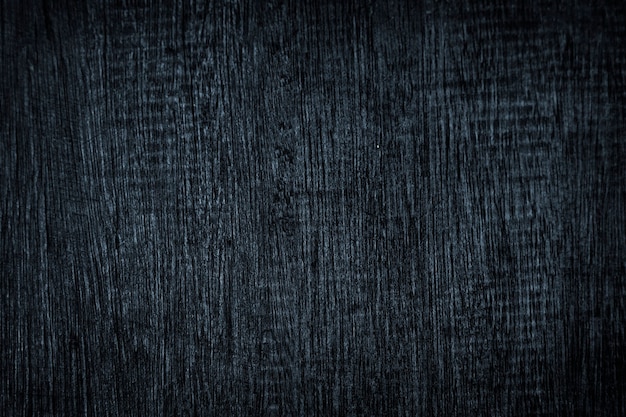 Почесал темно-синий деревянный текстурированный фон