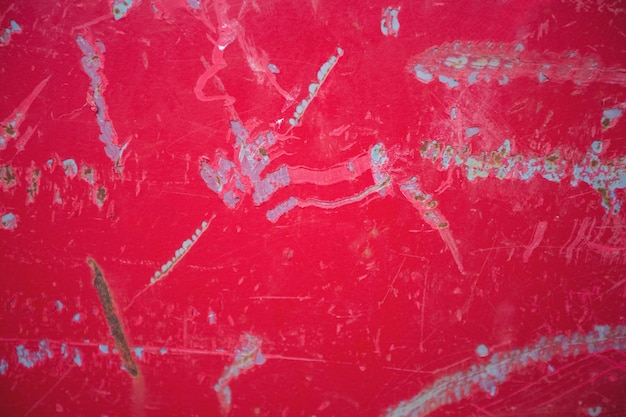 Scratches on red metal background