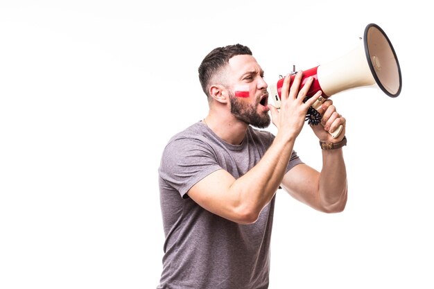 Scream on megaphone Poland football fan in game supporting of Poland national team on white background. Football fans concept.