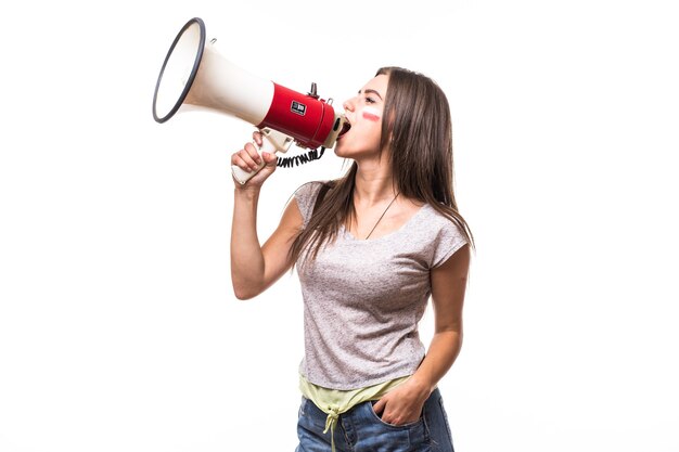 Scream on megaphone Poland woman football fan in game supporting of Poland national team on white background. Football fans concept.