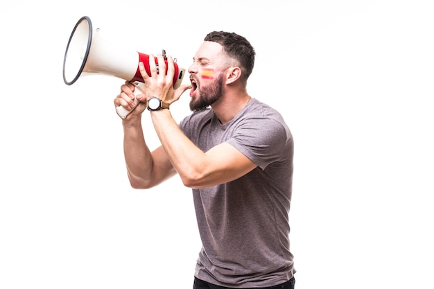 Scream on megaphone Spain football fan in game supporting of Spain national team on white background. Football fans concept.