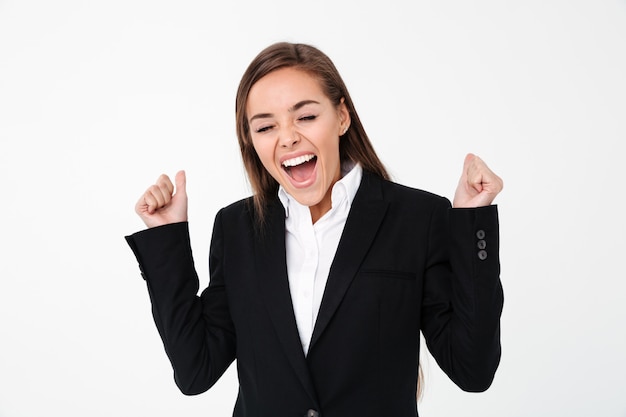 Screaming excited business woman standing isolated
