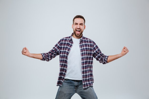 Screaming happy Bearded man in shirt