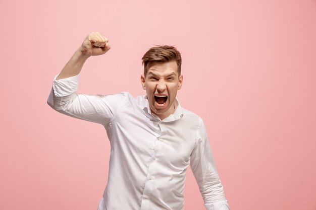 Screaming, hate, rage. Crying emotional angry man screaming on pink. Emotional, young face. male half-length portrait. Human emotions, facial expression concept. Trendy colors