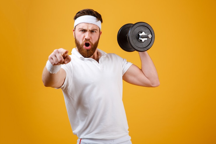 Free Photo screaming sportsman holding dumbbell