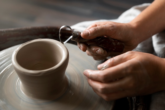 Sculptor artist working with clay in the studio