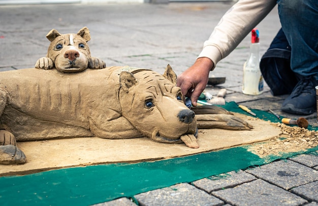 Sculpture of a dog from clay modeling from clay