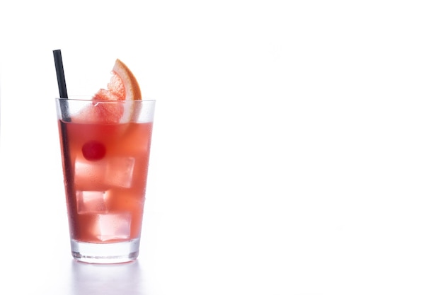 Sea breeze cocktail in glass on wooden table