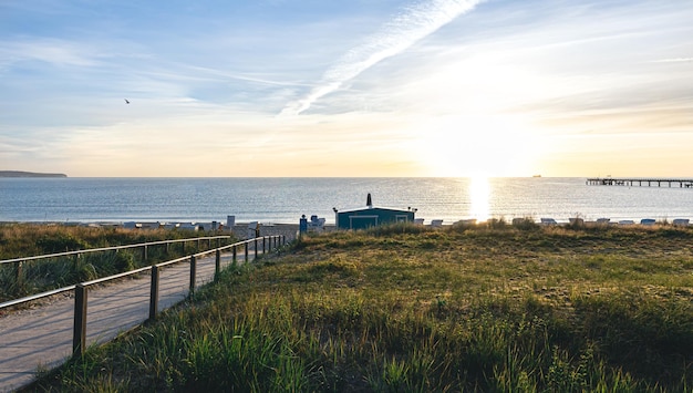 Sea embankment at sunset with a clear cloudless sky