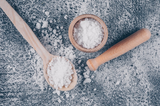 Sea salt in a bowl and spoon with rolling pin