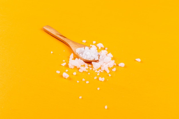 Free photo sea salt in a wooden spoon