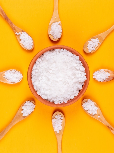 Sea salt in wooden spoons and bowl