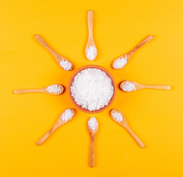 Sea salt in wooden spoons and bowl