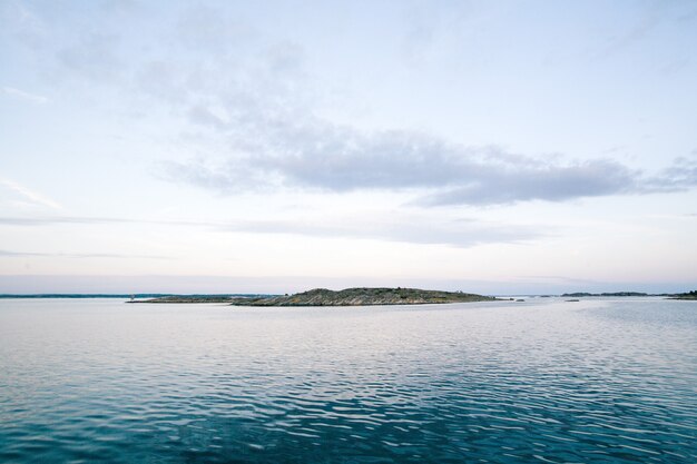 Sea with a mountain under a beautiful sky