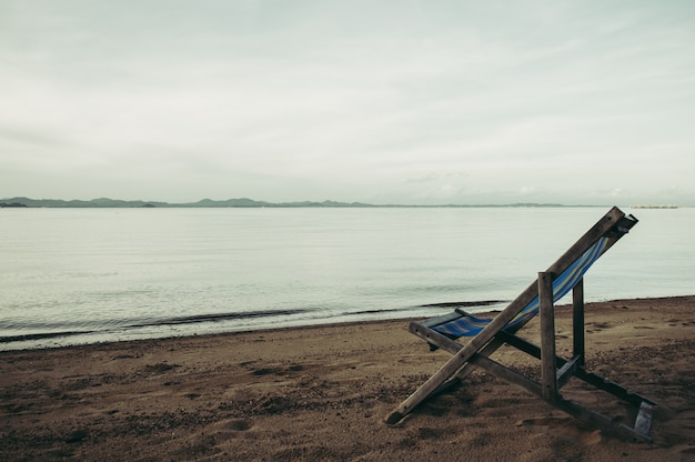 Sea with resort and beach chairs