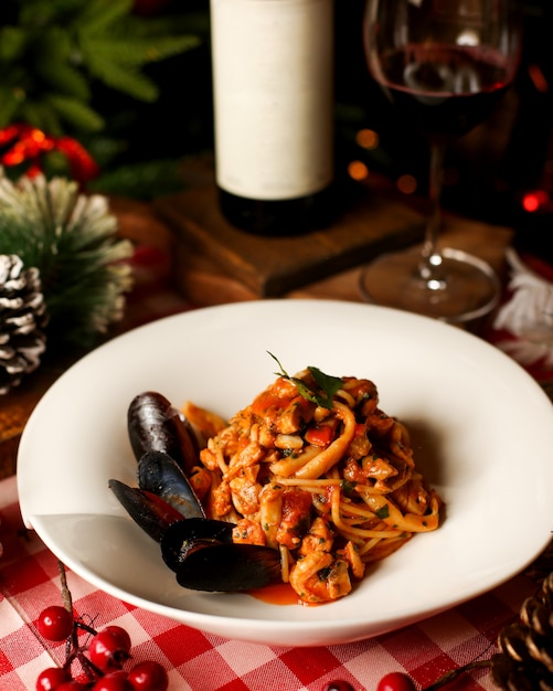 Seafood pasta in tomato sauce with mussels
