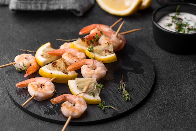 Seafood shrimp skewers on plate high view