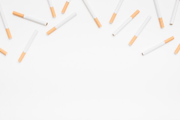 Seamless pattern of cigarettes on white background