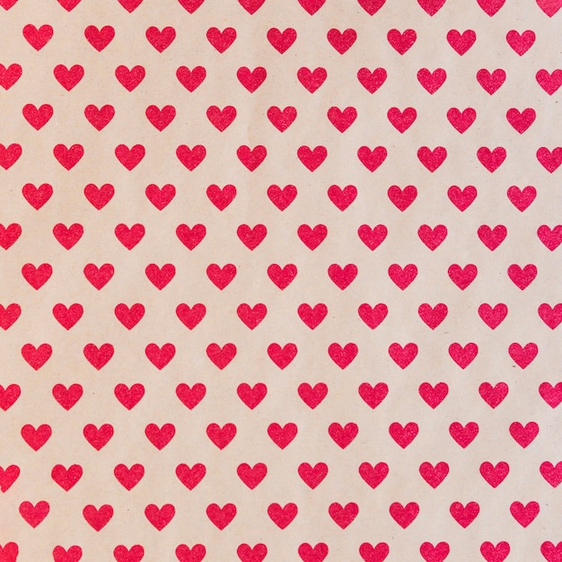 Seamless pattern with red hearts 