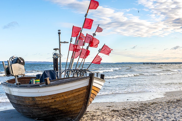Free Photo seascape with a boat on the seashore