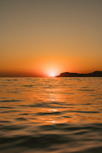 Seascape with clear sky and waves on sunset