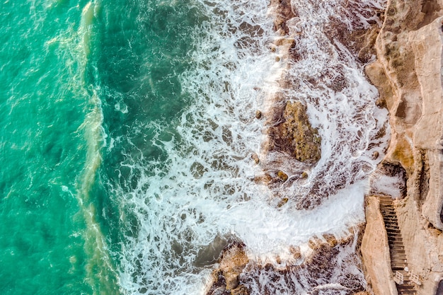 Seascape with waves breaking against the rocks