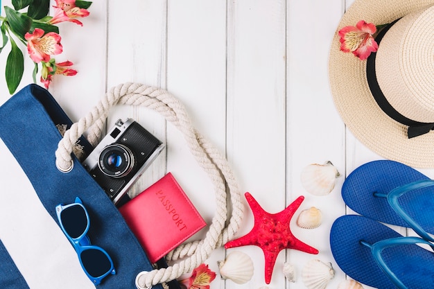 Free photo seashells and cute flower near vacation supplies