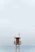 Free photo seaside view with wooden lifeguard tower