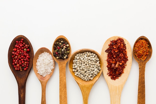 Seasoning ingredients on wooden spoons