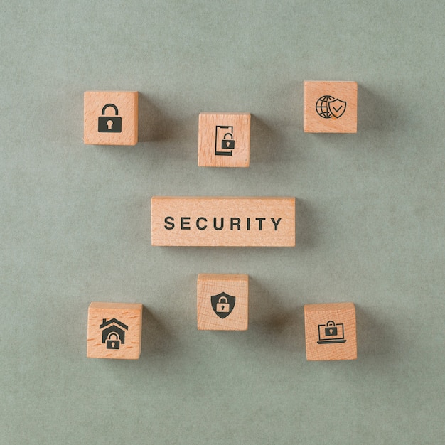 Security concept with wooden blocks with icons.