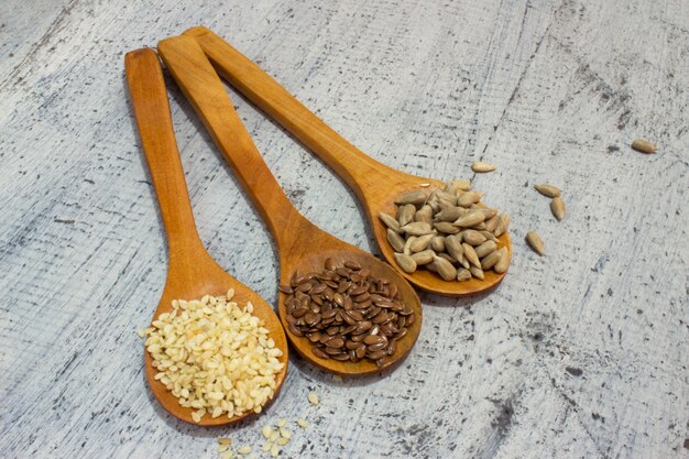 Seeds. Seeds in Wooden spoon. sunflower seeds. caraway , benni , sesame