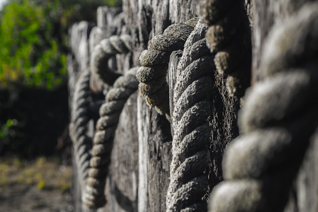 Selective closeup shot of tied gray wire ropes