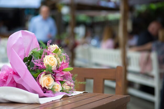 Selective focus  of a beautiful bouquet on a wooden table