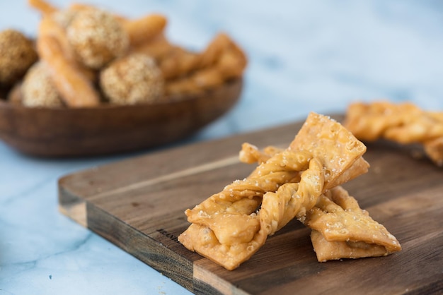 Selective focus shot of brushwood cookies on a wooden board