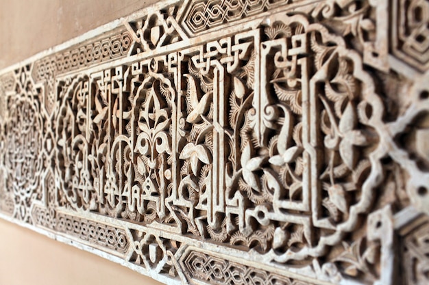 Selective focus shot of a carving of Real Alcazar, Spain