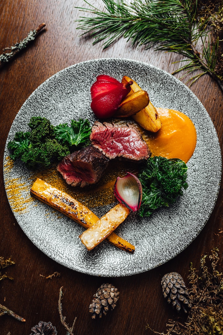 Free Photo selective focus shot of delicious cooked meat with vegetables
