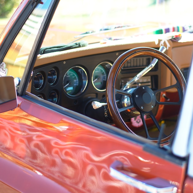 Free photo a selective focus shot of a low rider car steering wheel