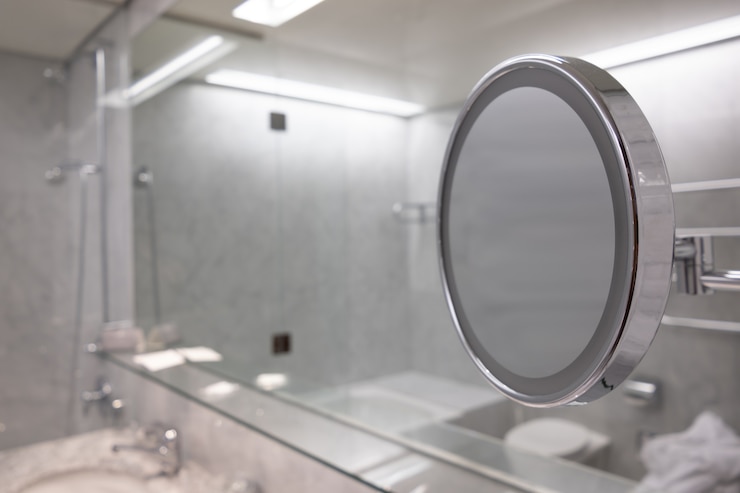 Free Photo selective focus shot of the mirror in the bathroom with white interior