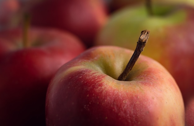 Selective focus shot of red apples placed on the table