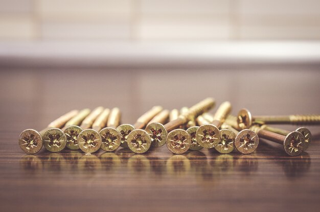 Selective focus shot of screwdrivers on a wooden surface