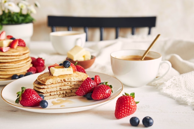 Selective focus shot of sliced vegan pancakes with fruits
