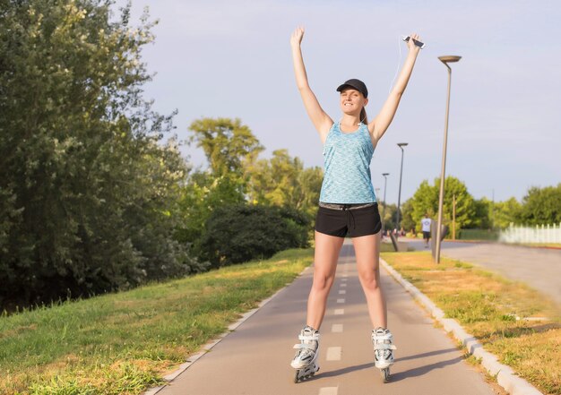 Selective focus shot of a young white female roller skating