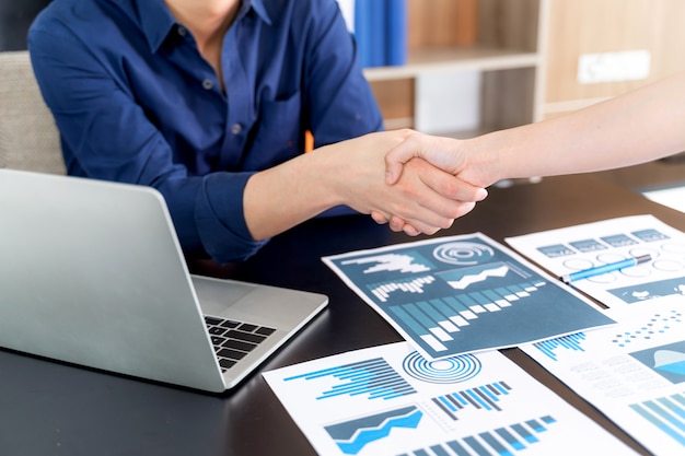 Free Photo selective focus young man handshake with someone at office