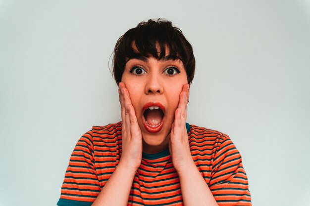 Self-portrait of a caucasian female with a surprised facial expression