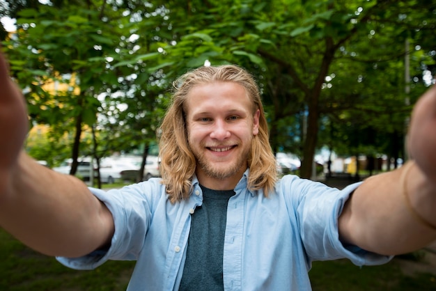 Free photo selfie of happy man outdoors