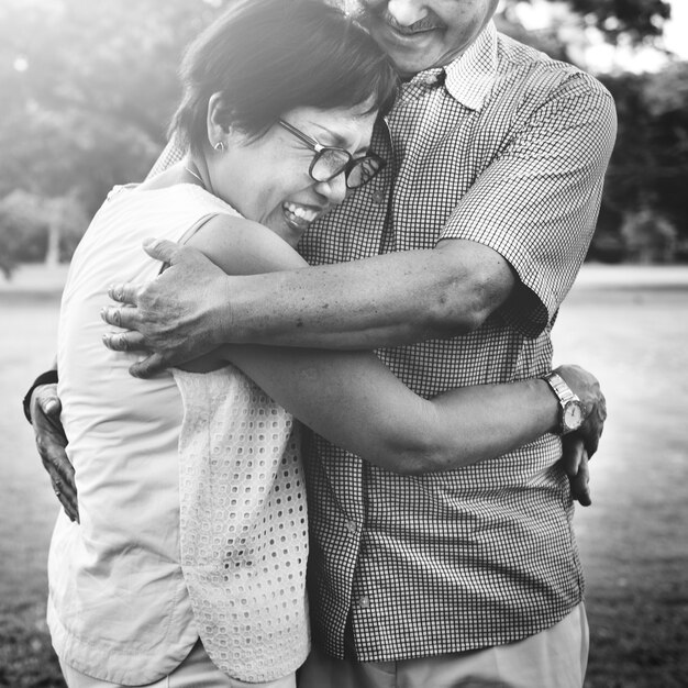 Senior Asian couple hugging each other