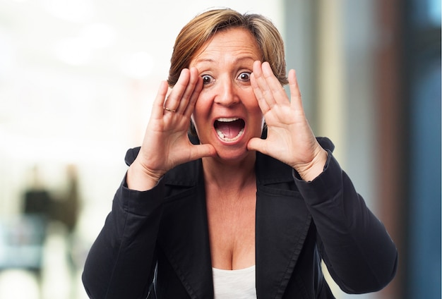 Free photo senior business woman screaming