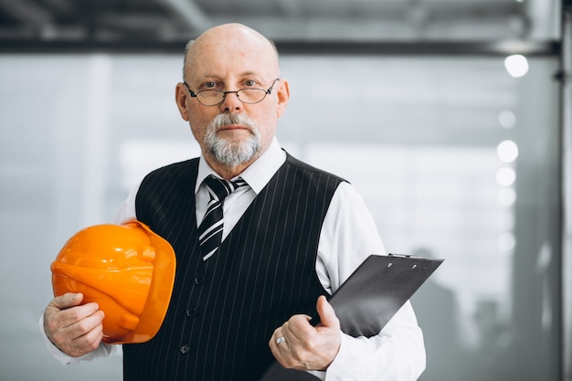 Senior businessman architect in a hard hat